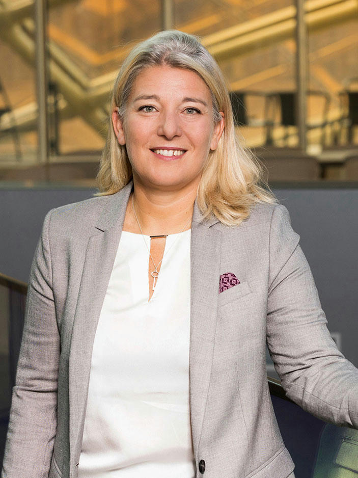 pascale-chapuis Pascale Chapuis in suit, smiling.